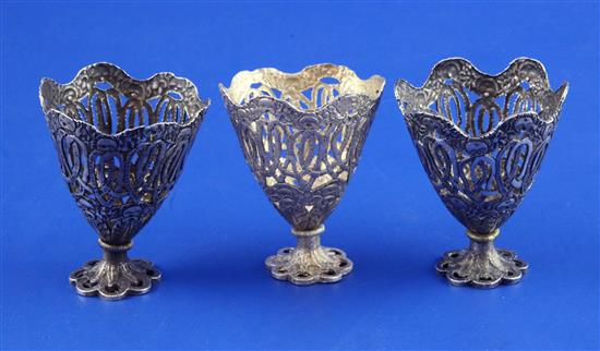 Three early 20th century Turkish silver zarfs, 2.25in.